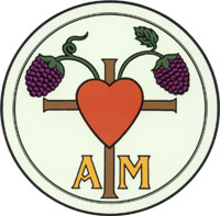 A pair of grape bunches growing out of the top of a brown cross with a large red hear superimposed on them and the letters "A M" in yellow on either side