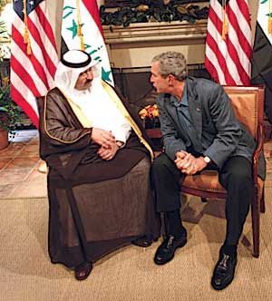 George W. Bush confers with Ghazi Mashal Ajil al-Yawer of the Iraqi interim government during the June 9, 2004 G–8 summit at Sea Island, GA