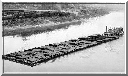 Paddlewheel tow boat Sprague, the largest river steamboat in the world, towing 50,000 tons of coal in barges.
