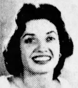 A smiling woman with fair skin and dark hair
