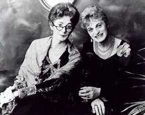 Two elderly ladies dressed in evening wear