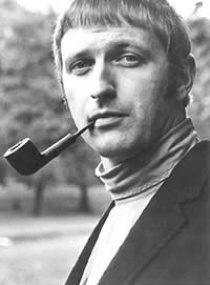 A black-and-white photo of Chapman with a pipe