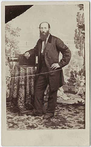 Photograph of Edward Kusel with a camera.jpg