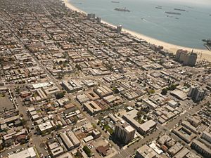 The Alamitos Beach neighborhood of Long Beach, California, looking southeast. Alamitos Avenue runs left to right across the center of the photo; Alamitos Beach is located above it, with the East Village below. 4th Street cuts from the top left corner to the bottom center; Alamitos Beach is to the right of it.