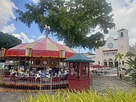 Carousel and church at main plaza in Caguas, Puerto Rico