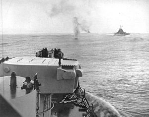 A Japanese plane crashes into the sea ahead of USS Columbia (CL-56), in November 1943 (80-G-44059)