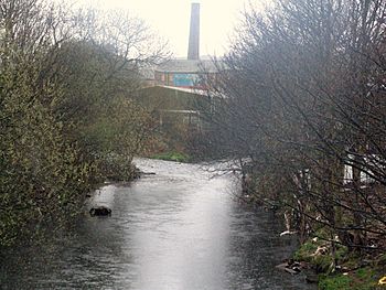 River Holme (left) joining River Colne at Huddersfield, West Yorkshire, UK (RLH).JPG