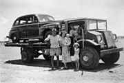 StateLibQld 1 183407 Car of a Brisbane tourist being taken on a truck to Quilpie railhead, 1952