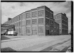 VIEW NORTHEAST-ELMER STREET; CENTER-BUILDING 102-ELMER STREET ROPE SHOP (1917); RIGHT-BUILDING 101-CLARK STREET ROPE SHOP (1917) - John A. Roebling's Sons Company and American HAER NJ,11-TRET,33-66.tif