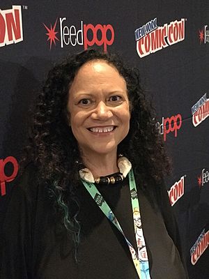 Randall standing in front of a New York Comic Con-branded backdrop