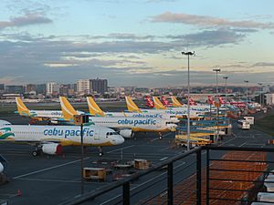 Cebu Pacific and Air Asia planes outside NAIA Terminal 3 (Pasay; 11-24-2021)
