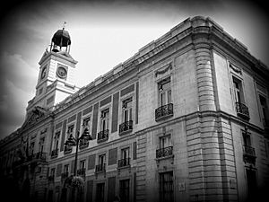 Black and white photograph taken at Puerta del Sol in Madrid
