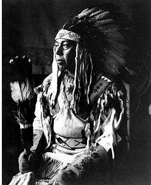 Chief Garry of the Spokane Indian tribe, in headdress and beaded shirt (CURTIS 624).jpg