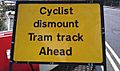 Midland Metro - Cyclist dismount sign - Andy Mabbett
