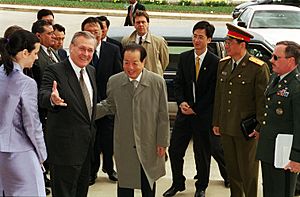 Donald Rumsfeld welcomes Vice Premier Qian Qichen as he arrives at the Pentagon on March 22, 2001