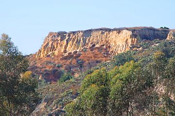 Cliffs in Coyote Hills, Fullerton, CA, seen from Ralph B. Clark Park.jpg