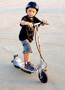 Boy on electric scooter 5988226382 e289654724 z