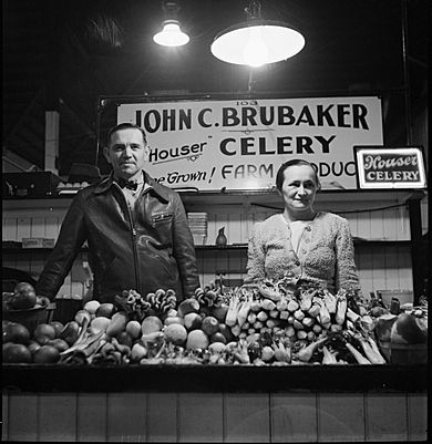 Farmer and his wife at her stall in Central Market. Lancaster, Pennsylvania 8d23430u