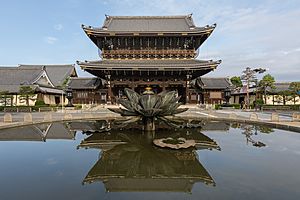 Founder's Hall gate of Higashi-Honganji Temple, with water reflection, Kyoto, Japan