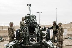 Army Secretary visits with an M777 howitzer gun crew in Afghanistan in December 2017 as the service prioritized a rebuilding of its long-ranger artillery capabilities