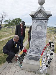 Eric Holder at Wounded Knee Memorial
