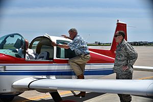 Jim Inhofe boards his airplane positioned in front of Base Ops following a brief visit to Tinker Air Force Base