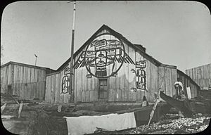 Kwakwaka'wakw (Kwakiutl) house decorated with three designs, Fort Rupert Indian Reserve 1, British Columbia (706 LS) (cropped)