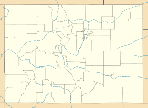A map of Colorado showing county boundaries and major watercourses. There is a red dot in the middle of Pitkin County, in the west central region of the state