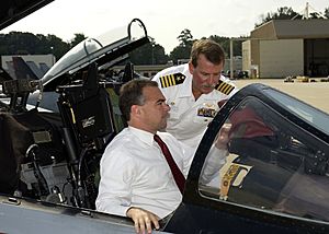 US Navy 030820-N-4294K-006 Commanding Officer, Naval Air Station (NAS) Oceana, Capt. T.F. Keeley briefs Virginia's Lt. Governor, Tim Kaine, on the cockpit of an F-14 Tomcat
