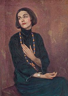 Paul Swan - Portrait of Isadora Duncan, wearing a blue dress, with a beaded necklace, 1922