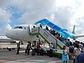 Spring Airlines aircraft with passenger boarding stairs @ PVG