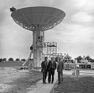 RAL directors Drs. Manning, Houghton and Stafford standing under the IRAS dish (38543575661).jpg