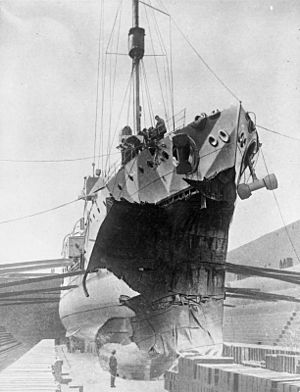 Black and white photo of a ship in dry dock