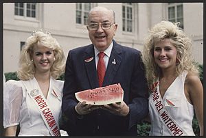 Senator Jesse Helms holding a watermelon