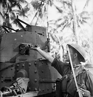 013955 Australian infantryman getting grenades Buna