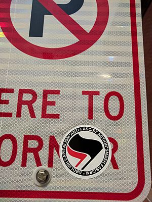 Antifa sticker on No Parking sign