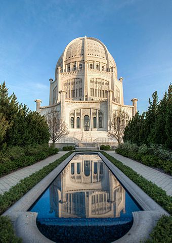 Baháʼí Temple with reflecting pool in foreground.