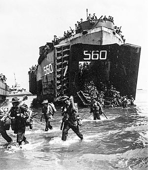 Australian troops land from USS LST-560 at Labuan on 10 June 1945