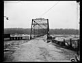 The Potomac River surges over Chain Bridge during 1936 Flood 19 March 1936