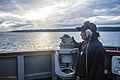 150625-N-XM324-031- U.S. Navy sailor takes navigational bearing aboard USS Fitzgerald