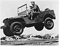 These soldiers go up in the air to prove that the Army's new quarter ton truck can take it. - NARA - 195336