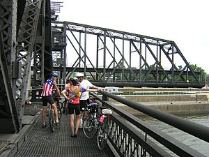 Cyclists on Arsenal Bridge waiting during a bridge opening (2006)