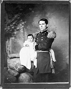 Portrait of General L. W. Colby of Nebraska State Troops Holding Baby Girl, Zintkala Nuni (Little Lost Bird), Found On Wounded Knee Battlefield, South Dakota, 1890 n.d
