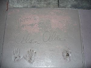 Alan Alda (handprints and signature in cement)