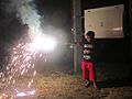 Child bursting firecracker, Howrah, 2016