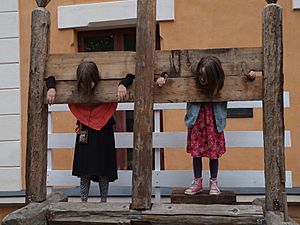 Girls in stocks at Turku Medieval market 2015