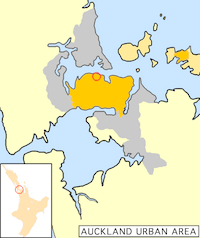 Auckland City's urban areas (in orange) within the greater Auckland urban region (grey). The city centre is ringed. Auckland City also encompassed islands of the inner (upper right) and outer Hauraki Gulf.