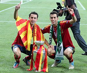 Xavi and Sergio Busquets Euro 2012 trophy
