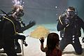 Flickr - Official U.S. Navy Imagery - Navy divers interact with a young visitor.