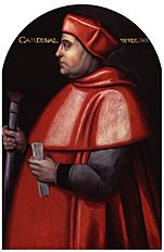A heavy-set middle-aged man in red cardinal's clothing, including the red cap, turned to the left side.